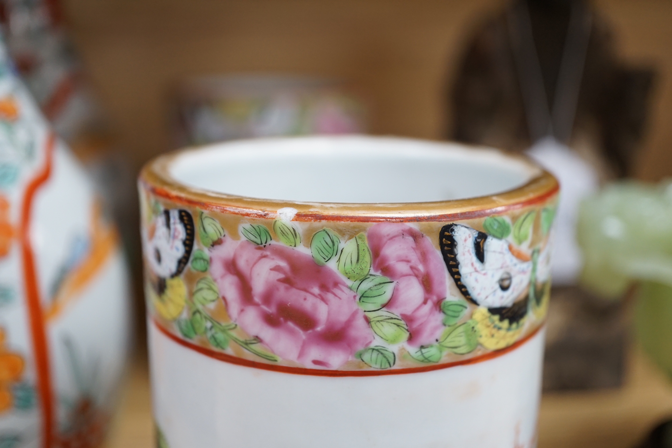 A pair of 19th century Cantonese famille rose porcelain brushpots, decorated with figural scenes, together with a further pair of Japanese export vases (4)